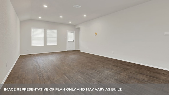 spare room featuring lofted ceiling and dark hardwood / wood-style flooring