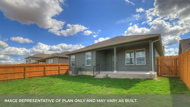 rear view of property with a lawn