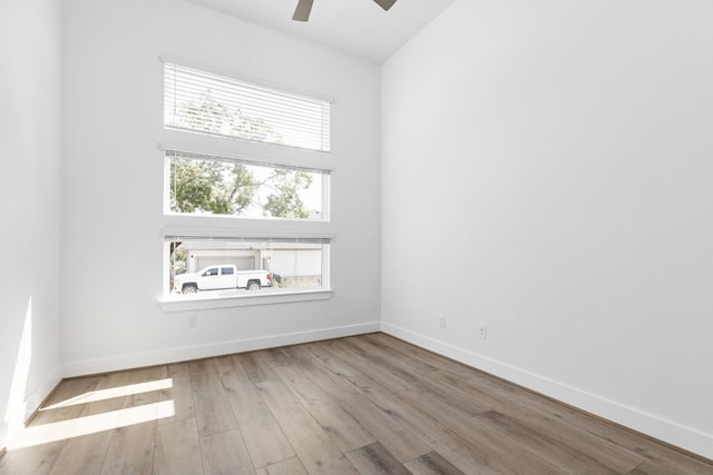 empty room featuring light hardwood / wood-style floors and ceiling fan