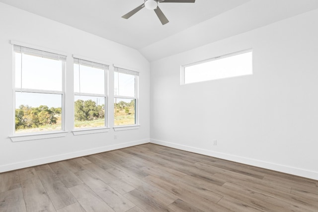 unfurnished room featuring ceiling fan, light hardwood / wood-style flooring, and lofted ceiling