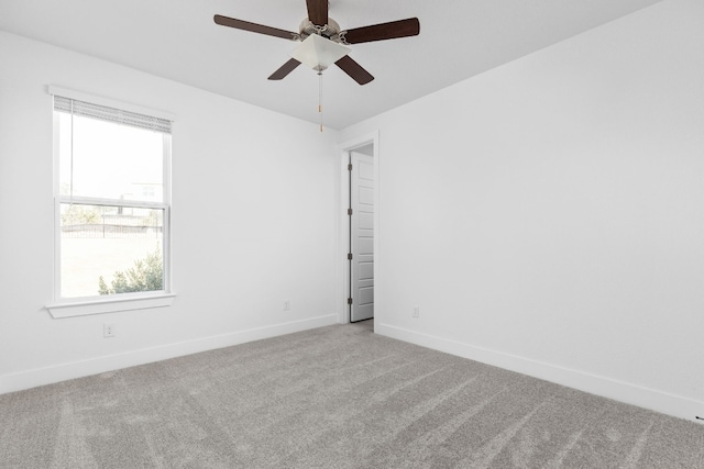 unfurnished room featuring ceiling fan and light colored carpet