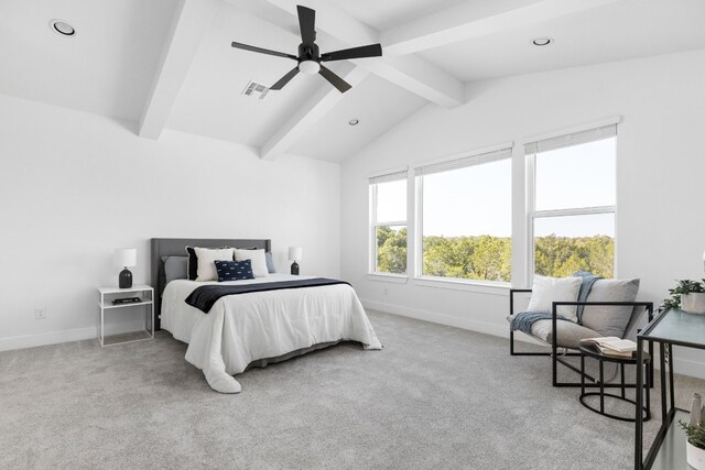 bedroom featuring ceiling fan, lofted ceiling with beams, and light colored carpet