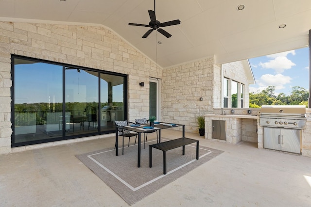 view of patio with ceiling fan and area for grilling