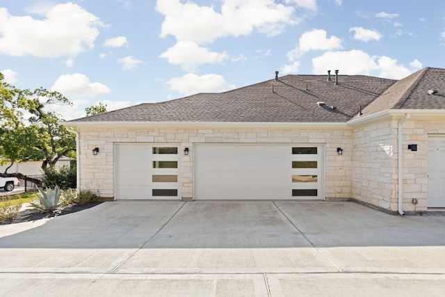 view of side of home with a garage