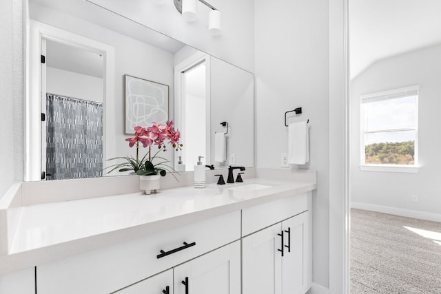 bathroom with vanity and walk in shower