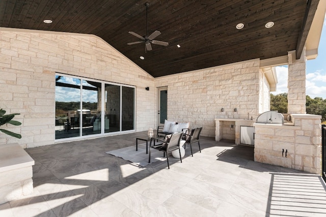 view of patio / terrace with area for grilling, sink, an outdoor kitchen, and ceiling fan