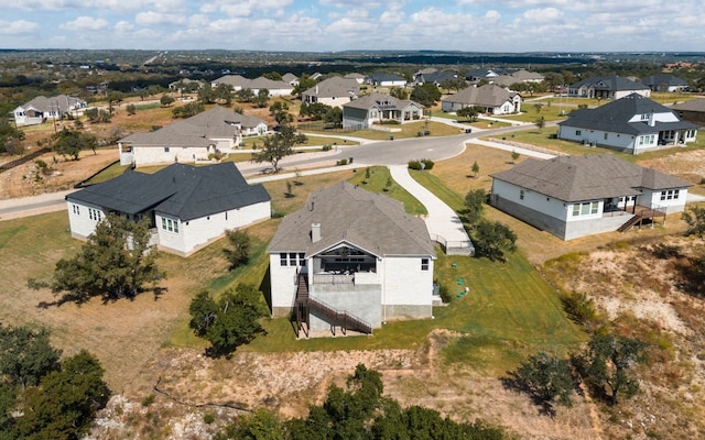 birds eye view of property with a residential view