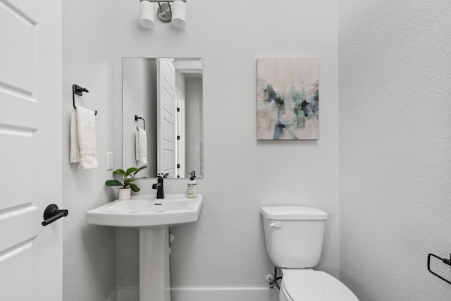 bathroom with a sink and toilet