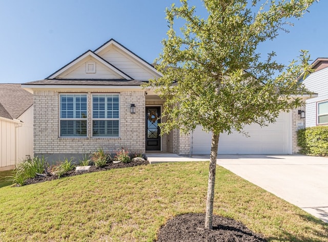 view of front facade with a front yard and a garage