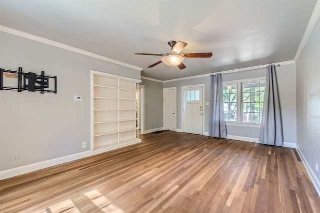 unfurnished living room with wood-type flooring, ornamental molding, and ceiling fan