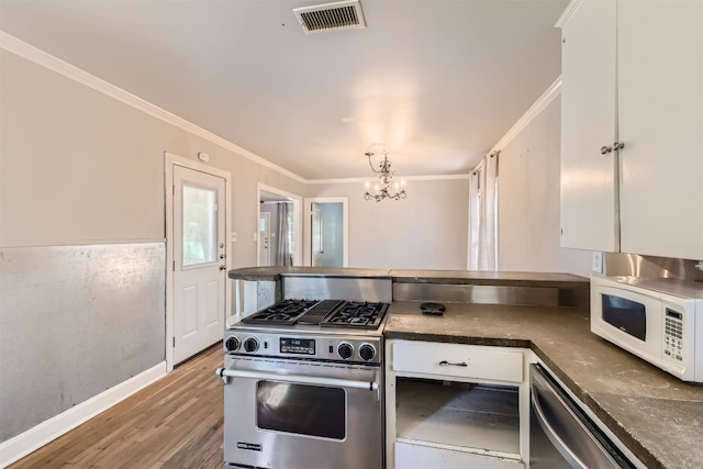 kitchen featuring white cabinetry, appliances with stainless steel finishes, and hardwood / wood-style floors