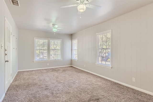 carpeted empty room with ceiling fan