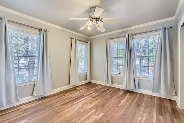 unfurnished room featuring light wood-type flooring, ceiling fan, and plenty of natural light