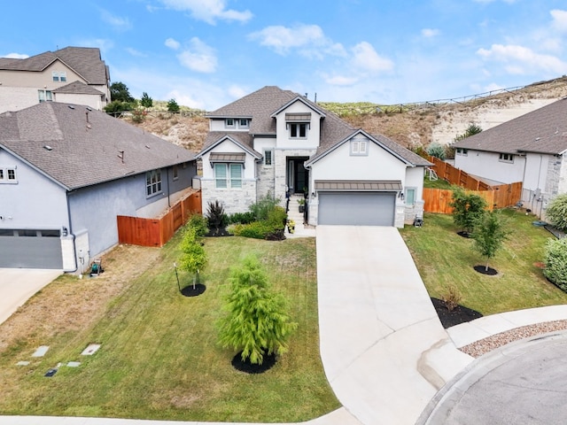 view of front facade with a garage and a front lawn