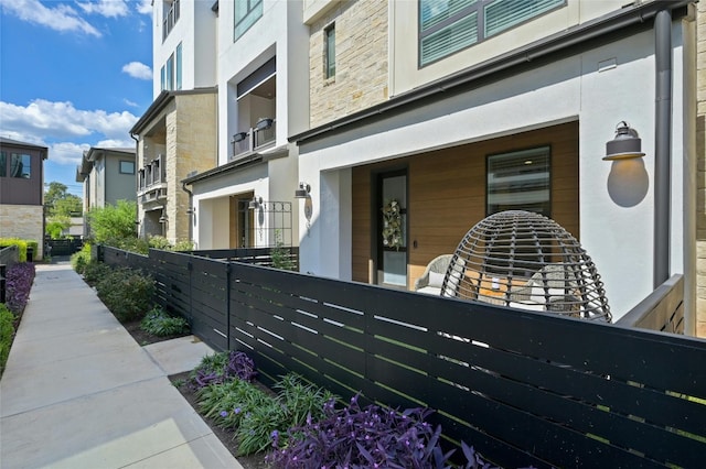 view of side of property featuring a balcony