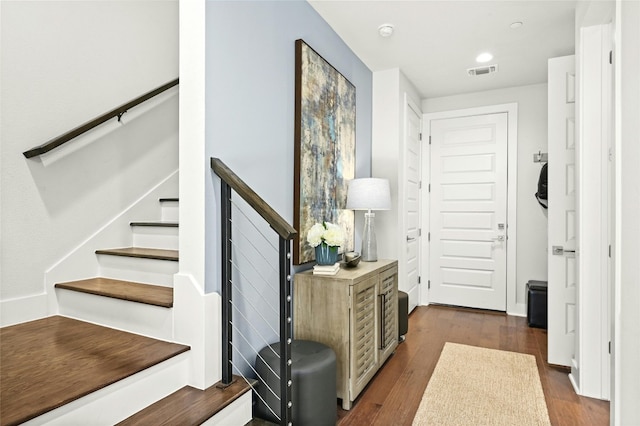 foyer entrance with dark hardwood / wood-style floors