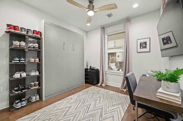 office area featuring wood-type flooring and ceiling fan