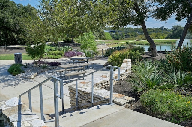 view of patio featuring a water view