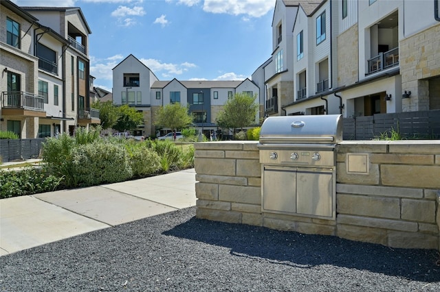 view of home's community featuring area for grilling