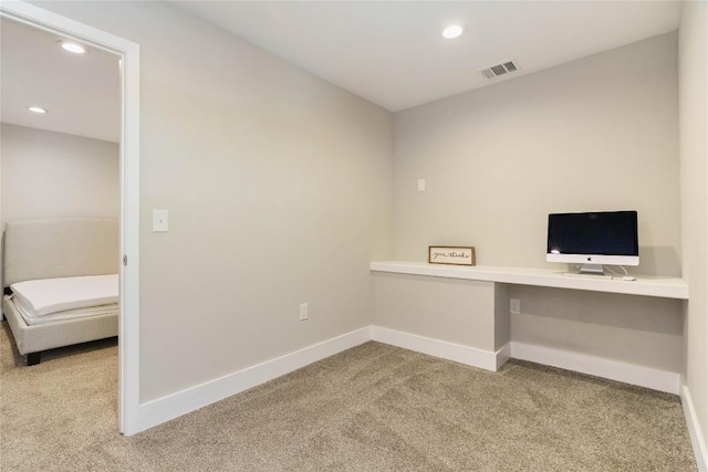 unfurnished office with recessed lighting, visible vents, baseboards, and carpet