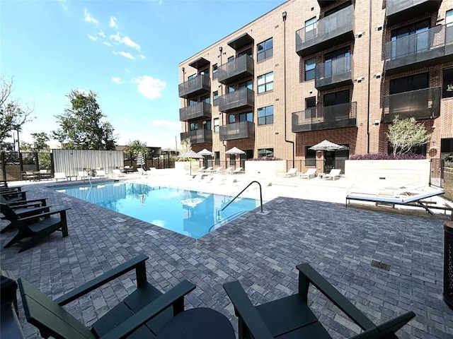4510 Terry-O Ln Unit 406, Austin, TX 78745 - community pool featuring a patio and fence