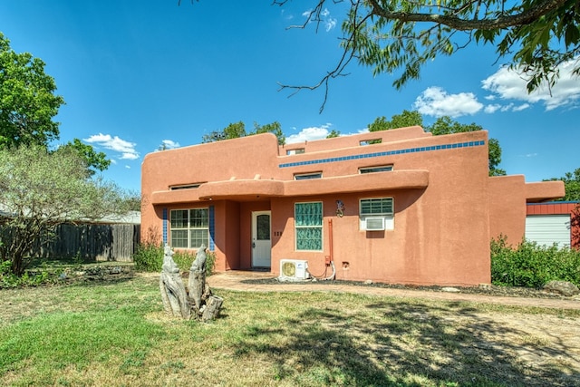 back of house featuring a yard