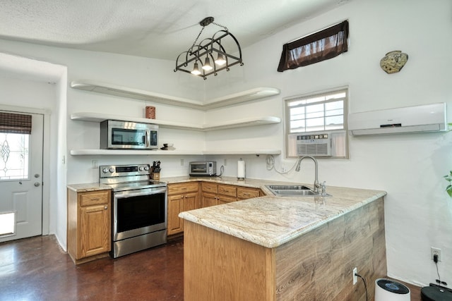 kitchen with hanging light fixtures, sink, kitchen peninsula, stainless steel appliances, and a wealth of natural light