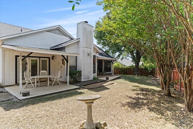 rear view of house featuring a patio