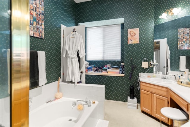 bathroom with vanity and a washtub