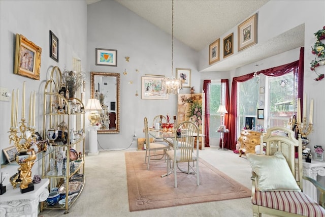 sitting room featuring a textured ceiling, a chandelier, light colored carpet, and high vaulted ceiling