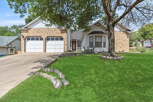 view of front of house with a front yard and a garage