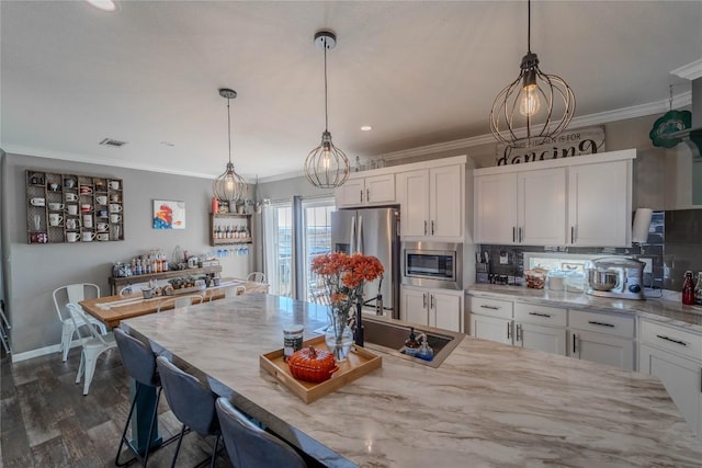 1256 Sunrise Vis, Thorndale, TX 76577 - kitchen with stainless steel appliances, backsplash, white cabinetry, light stone counters, and ornamental molding