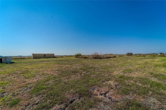1256 Sunrise Vis, Thorndale, TX 76577 - view of yard with an outbuilding and a rural view