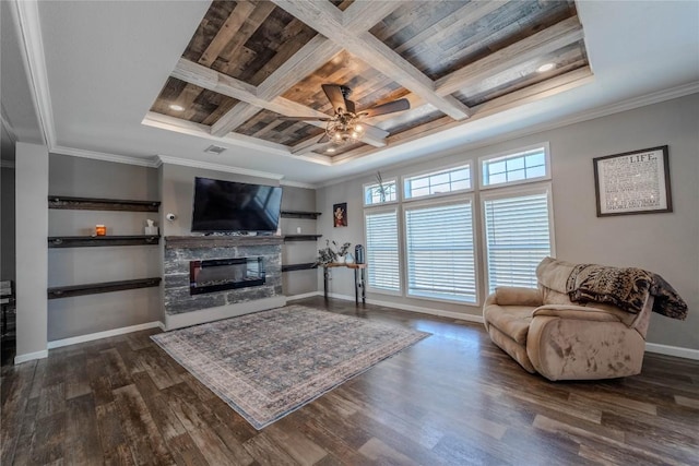 1256 Sunrise Vis, Thorndale, TX 76577 - living room featuring crown molding, ceiling fan, a fireplace, baseboards, and dark wood-style floors