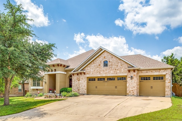 view of front facade featuring a front yard and a garage