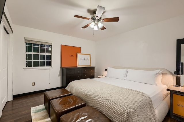 bedroom with a closet, ceiling fan, and dark hardwood / wood-style floors