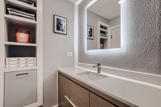 bathroom with vanity and built in features