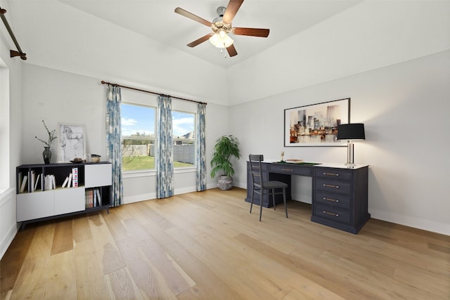 home office featuring light hardwood / wood-style floors and ceiling fan