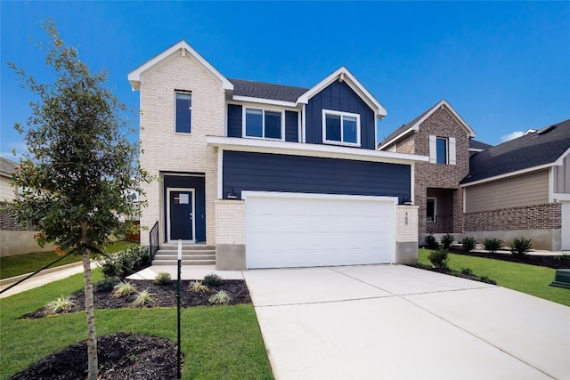 view of front of home featuring a front yard and a garage