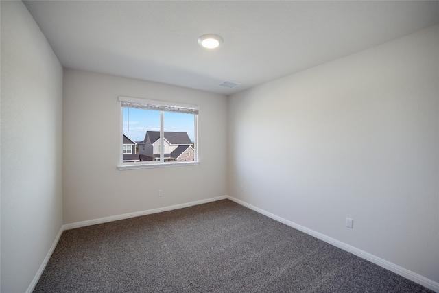 spare room featuring carpet flooring