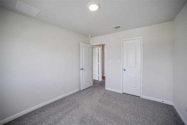 unfurnished bedroom with carpet floors and a closet