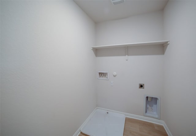 laundry room with washer hookup, hookup for an electric dryer, gas dryer hookup, and light hardwood / wood-style flooring