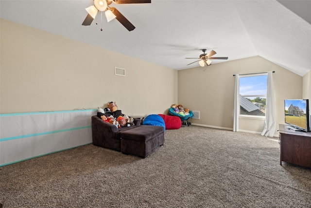 rec room featuring ceiling fan, vaulted ceiling, and carpet flooring