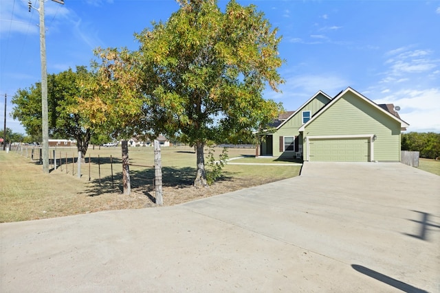 view of front of house with a garage and a front yard