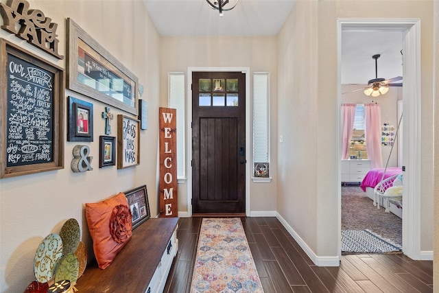 foyer featuring dark hardwood / wood-style flooring and ceiling fan