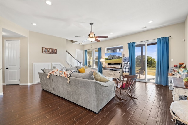 living room featuring dark hardwood / wood-style floors and ceiling fan