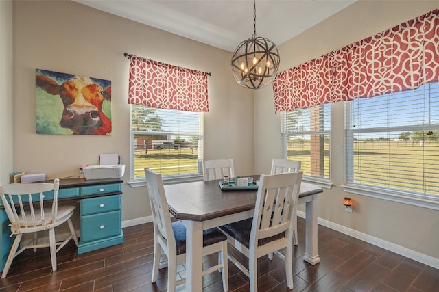 dining room featuring plenty of natural light, dark wood-type flooring, and a chandelier