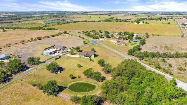 birds eye view of property with a water view and a rural view