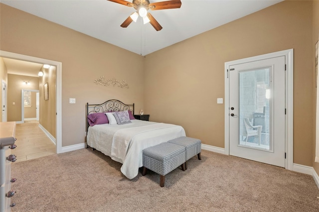 carpeted bedroom with ceiling fan and access to outside