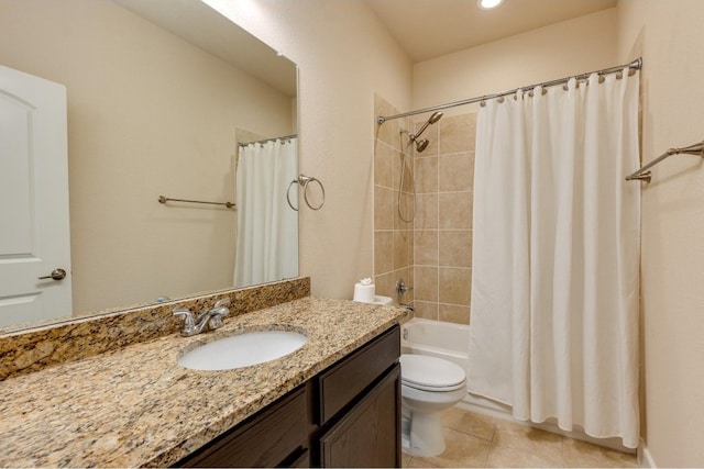 full bathroom featuring tile patterned flooring, shower / bath combo, vanity, and toilet